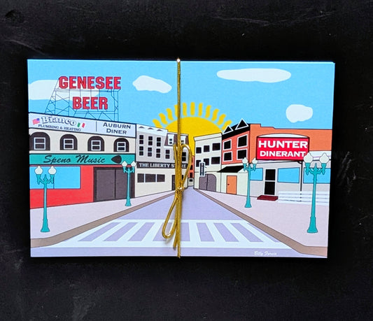 Downtown Auburn 5-pack postcards tied with gold ribbon, featuring iconic street scene with Genesee Beer sign and Auburn Diner