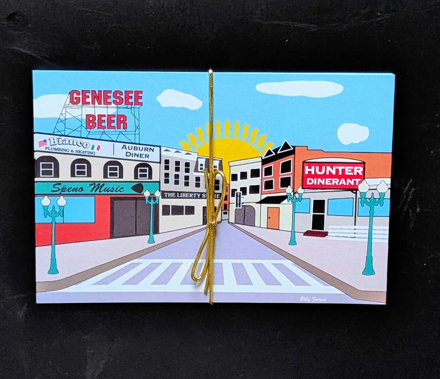 Downtown Auburn 5-pack postcards tied with gold ribbon, featuring iconic street scene with Genesee Beer sign and Auburn Diner